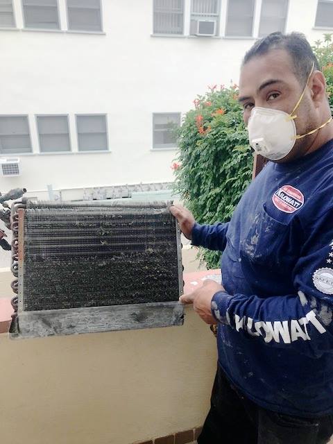 Team Member With Dirty AC Coils