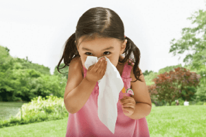 Little Girl Blowing Her Nose